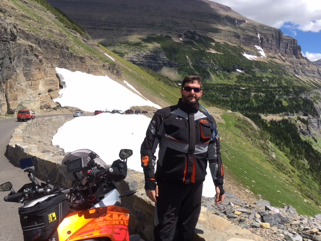 Howard with his bike. It was cool up there!