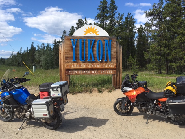 Our bikes at the Welcome to Yukon sign.