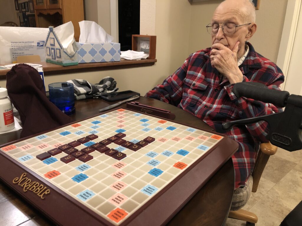 Dad playing Scrabble.