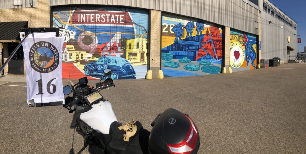 May 27 - This series of three overhead door murals is part of an incredible collection of murals in a south St. Paul industrial and arts district. These three depict scenes in the history of the area and are on one of the buildings of the Can Can Wonderland Brewery.